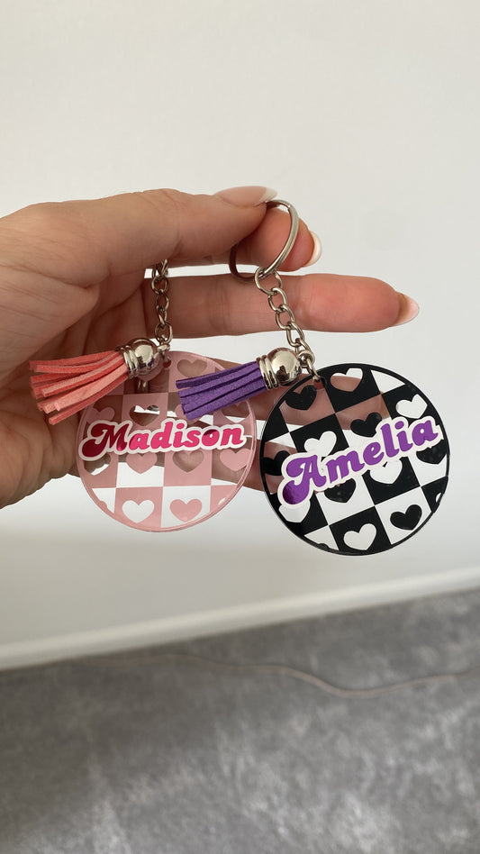 Keychain with personalized name on a plain background